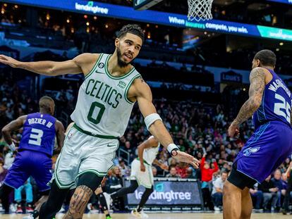 Boston Celtics forward Jayson Tatum (0) celebrates after a dunk against the Charlotte Hornets during the second half of an NBA basketball game on Saturday, Jan. 14, 2023, in Charlotte, N.C.