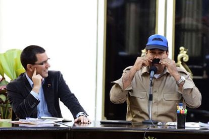 Venezuelan President Nicolas Maduro jokes around with his moustache alongside Vice President Jorge Arreaza on Tuesday.