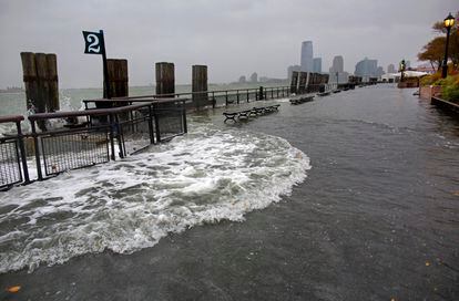 Waves wash over the seawall near high tide at Battery Park in New York, Oct. 29, 2012, as Hurricane Sandy approaches the East Coast