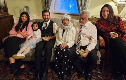 The new leader of the SNP and First Minister of Scotland, Humza Yousaf, poses with his family at his official residence in Edinburgh.