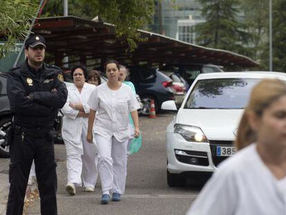 Staff arrive at the Carlos III hospital in Madrid on Tuesday. 