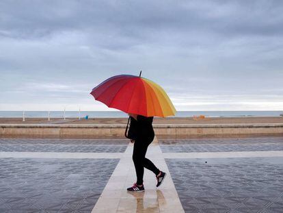 Rain falls in Malvarrosa beach in Valencia on Sunday.