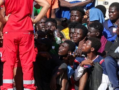 Migrants gather at a reception center for migrants in Lampedusa, Italy, September 17, 2023.