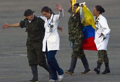 Medical personnel in Villavicencio, Colombia assist two former hostages released Monday.