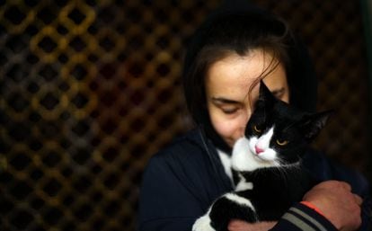 Daria, 22, with her cat Kitsuna.