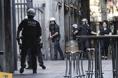 Police searching the Ramblas area shortly after the attack.