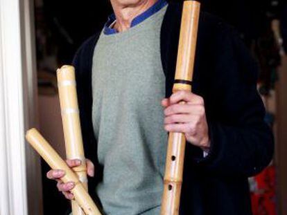 José Vargas poses with the Japanese flutes he makes in the Madrid region.