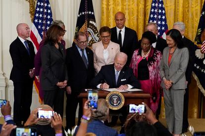 President Joe Biden signs an executive order in the East Room of the White House, May 25, 2022, in Washington.
